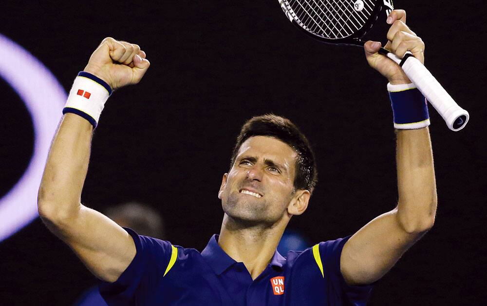 Novak Djokovic of Serbia celebrates after defeating Roger Federer of Switzerland in their semifinal match at the Australian Open tennis championships in Melbourne, Australia.