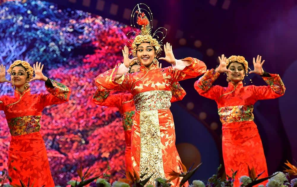 Artists perform during the inauguration of the 8th Bengaluru International Film Festival at Vidhan Soudha in Bengaluru.