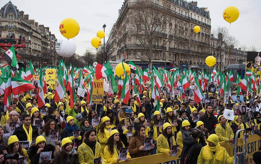 Iranian opposition protesters take the streets in Paris to protest against executions in Iran, as Iranian President Hassan Rouhani is in France for a two-day official visit.