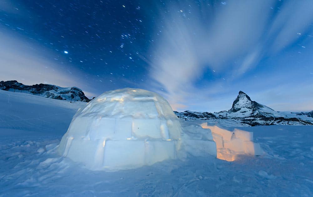 Long-time exposure photo shows an Igloo at the 'Igloo village' (Iglu Dorf) in front of the famous Matterhorn mountain in Zermatt, Switzerland. 