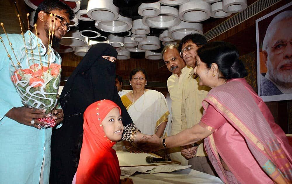 Union Minister Sushma Swaraj interacts with a local Muslim family during her visit to Mumbai on Friday as part of Prime Minister Narendra Modis directive to his ministers to reach out to the people on the work done by the NDA government.