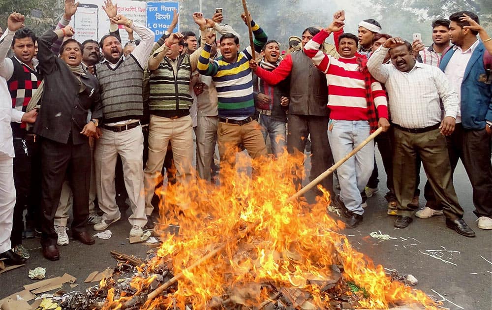 MCD workers burning effigies during a protest over their demands at Civil Lines in New Delhi.