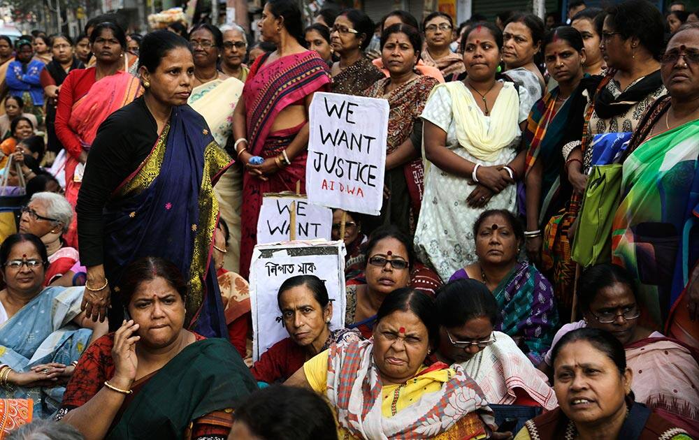 Women activists participate in a demonstration demanding highest punishment for convicted persons in the Kamduni rape case and the re-arrest of two acquitted persons near the city court in Kolkata.