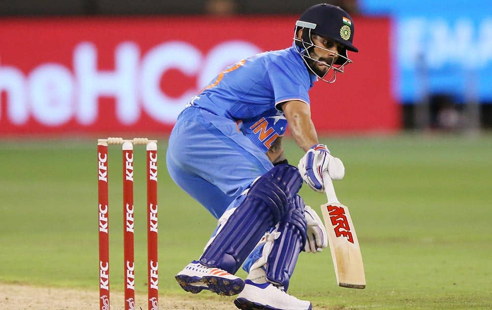 Virat Kohli makes a run during their T20 Match against Australia in Melbourne, Australia.