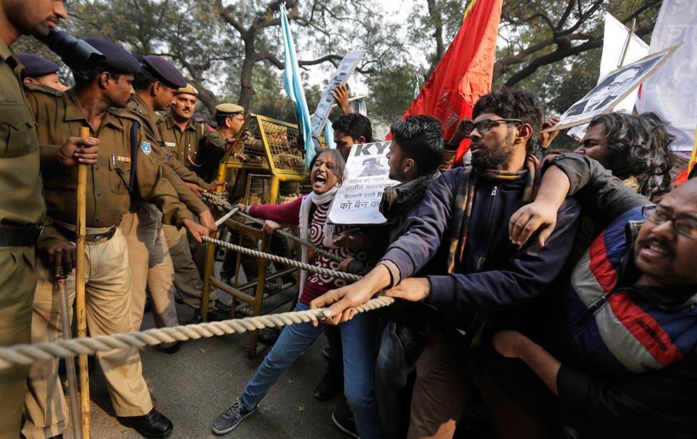 Students try to make their way through police barricade as they march towards the office of Hindu nationalist Rashtriya Swayamsevak Sangh (RSS) or the National Volunteers Association's office during a protest against the death of 26-year-old doctoral student Rohith Vemula in New Delhi.