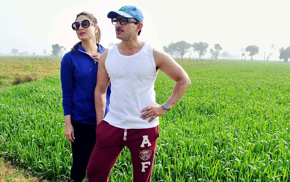 Bollywood actor Saif Ali khan and Kareena Kapoor pose for a photo in the field of wheat at Pataudi area in Gurgaon.
