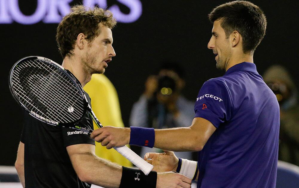 Novak Djokovic, right, of Serbia is congratulated by Andy Murray of Britain after winning the men's singles final at the Australian Open tennis championships in Melbourne