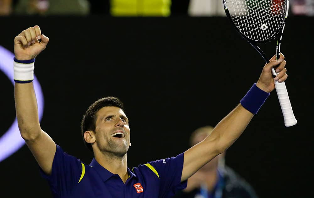 Novak Djokovic of Serbia celebrates after defeating Andy Murray of Britain in the men's singles final at the Australian Open tennis championships in Melbourne.