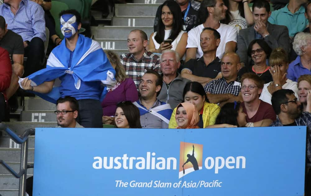 A supporter Andy Murray of Britain cheers him on during his match against Novak Djokovic of Serbia in the men's singles final at the Australian Open tennis championships in Melbourne.