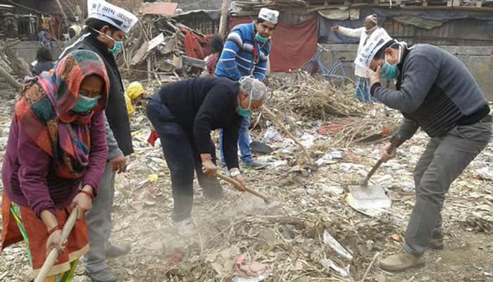Delhi CM backs striking sanitation workers, AAP leaders clean garbage