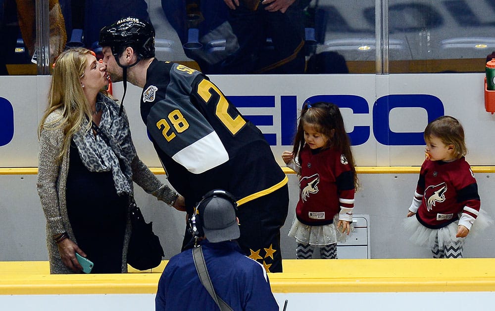 Pacific Division forward John Scott kisses his wife after being named most valuable player in the NHL hockey All-Star championship game.