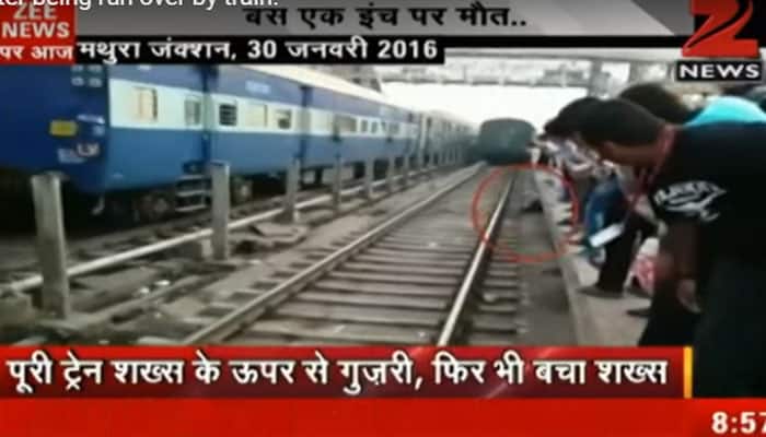 Man escapes unhurt after being run over by train at Mathura junction – Viral video
