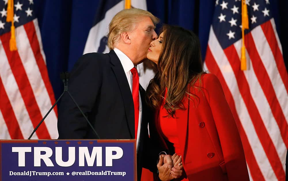 Republican presidential candidate Donald Trump kisses his wife Melania during a campaign event in Waterloo, Iowa.