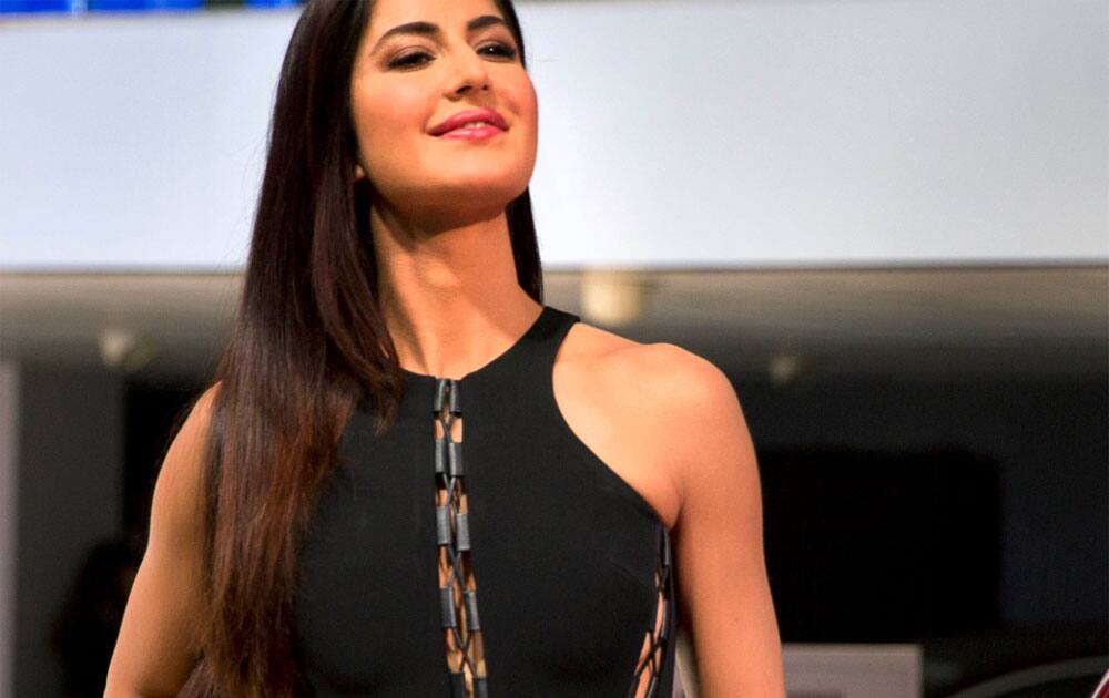 Bollywood actress Katrina Kaif poses next to the newly launched 