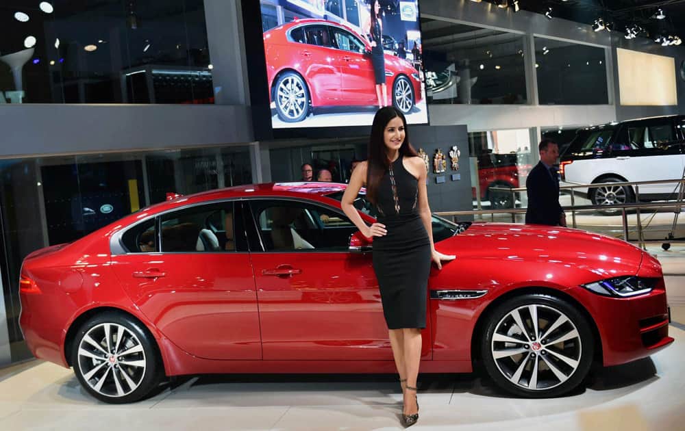 Actress Katrina Kaif poses with a Jaguar Land Rover at Auto Expo 2016 in Greater Noida on Wednesday. Jaguar launched the XE in India at the expo