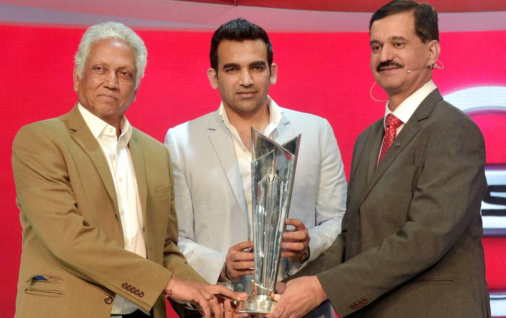 Former cricketers Mohinder Amarnath and Zaheer Khan unveil the World T20 Trophy at Nissan stall during the Auto Expo 2016 at Greater Noida on Wednesday. 