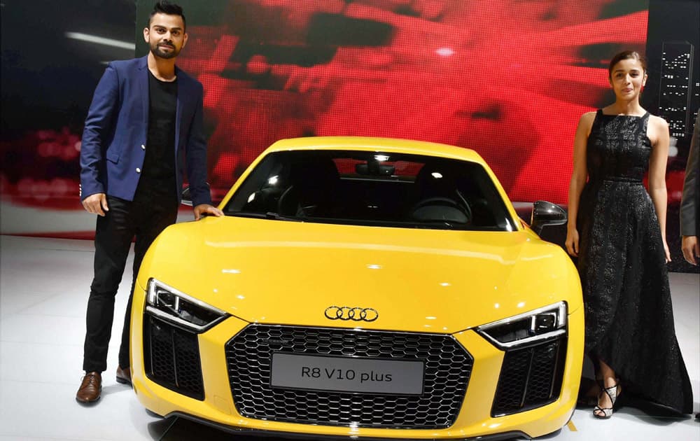 Cricketer Virat Kohli and actress Alia Bhatt at the launch of Audis new sports car R8 V10 plus at Auto Expo 2016 in Greater Noida on Wednesday.