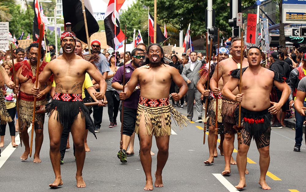 Maori join protestors marching down Queen Street opposing the signing of the Trans-Pacific Partnership Agreement in Auckland, New Zealand.