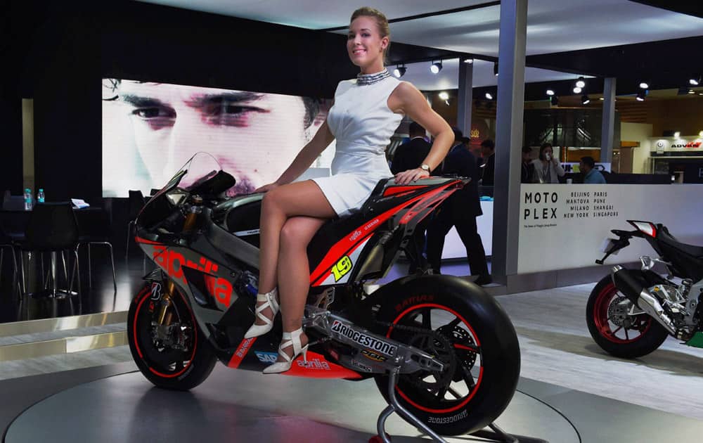 A model poses on a superbike at Auto Expo 2016 in Greater Noida on Thursday. 