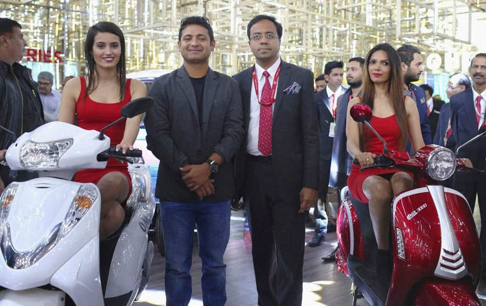 Cricketer Piyush Chawla and CEO, Lohia Auto Industries, Ayush Lohia at the unveiling of the companys path-breaking range of electric vehicles at Auto Expo 2016 in Greater Noida on Thursday. 