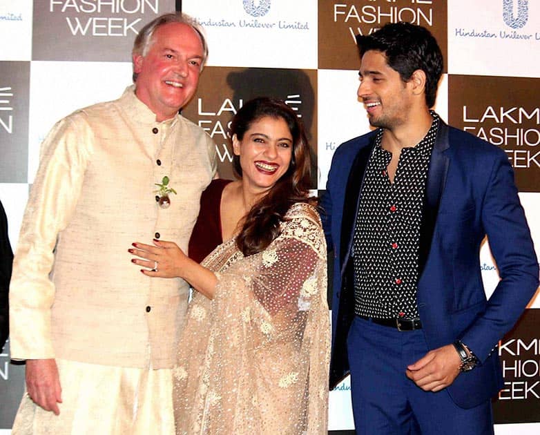 Actors Kajol and Sidharth Malhotra with Global CEO, Hindustan Unilever Limited, Paul Polman at the curtain raiser event of Lakme Fashion Week in Mumbai.