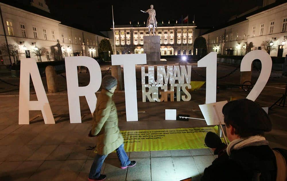 People protest against new legislation to increase the government's surveillance powers in front of the Presidential Palace in Warsaw, Poland.