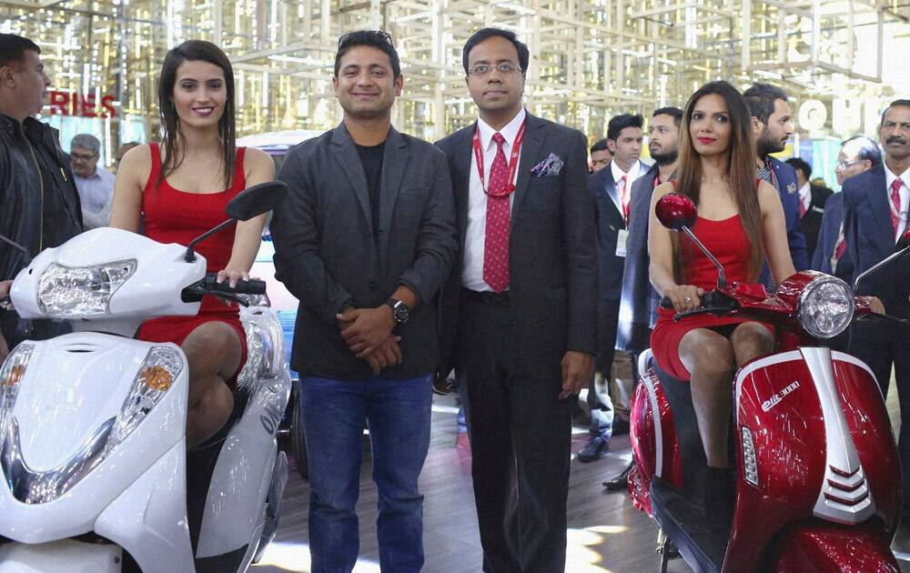 Cricketer Piyush Chawla and CEO, Lohia Auto Industries, Ayush Lohia at the unveiling of the companys path-breaking range of electric vehicles at Auto Expo 2016 in Greater Noida.