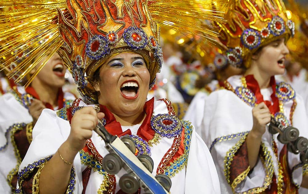 A drummer from the Aguia de Ouro samba school performs during a carnival parade in Sao Paulo, Brazil.