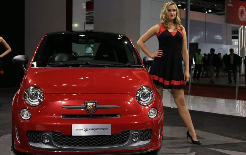 Model poses at Fiat pavillion at the Auto Expo in Greater Noida.