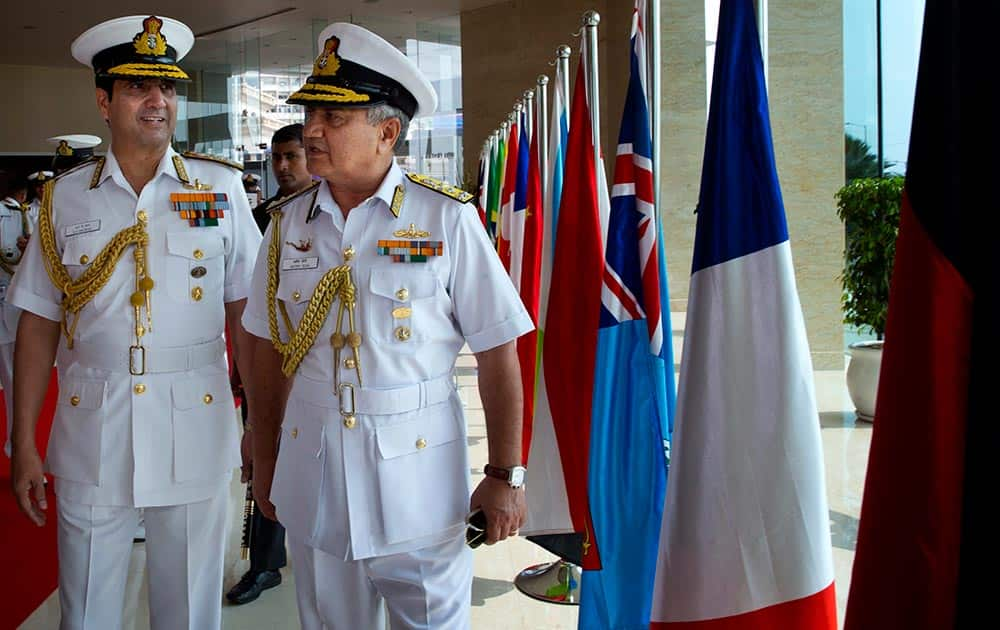 Chief of Naval Staff Robin K. Dhowan, left, arrives for a press conference with Flag officer Commanding in Chief of Eastern Command of the Indian Navy Satish Soni in Vishakapatnam.