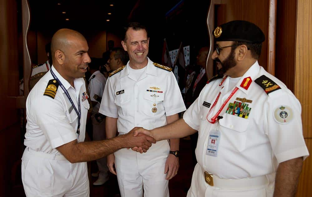 U.S. Chief of Naval Operations John Richardson, center, meets other foreign delegates during the International Fleet Review in Vishakapatnam.