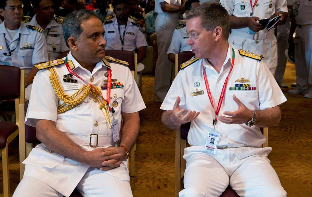 Chief of Navy of Australia Timothy Barrett, right, talks to Chief of Naval Staff of Bangladesh Mohammad Nizamuddin Ahmed during the International Fleet Review in Vishakapatnam