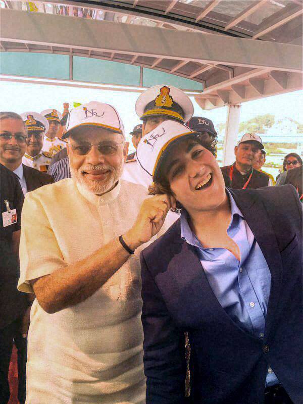 Prime Minister Narendra Modi pulls the ears of actor Akshay Kumars son Aarav in jest at the venue of the International Fleet Review in Visakhapatnam.