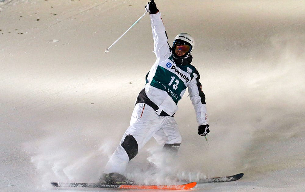 Anthony Benna, of France, celebrates after his jump in the men's dual moguls at the World Cup freestyle skiing competition in Park City, Utah. Benna won the event.