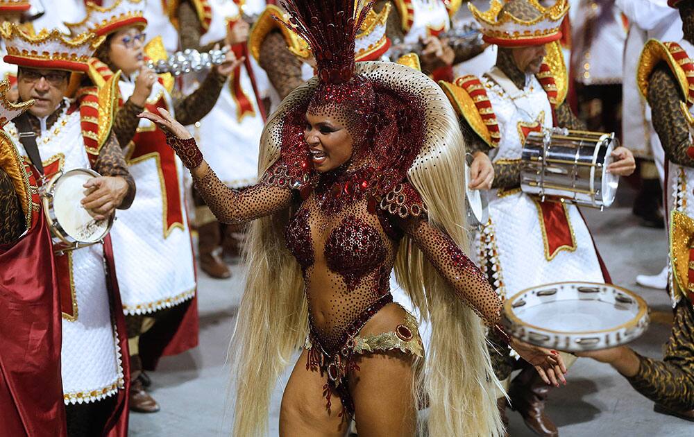 A dancer from the Imperio de Casa Verde samba school performs during a carnival parade in Sao Paulo, Brazil.