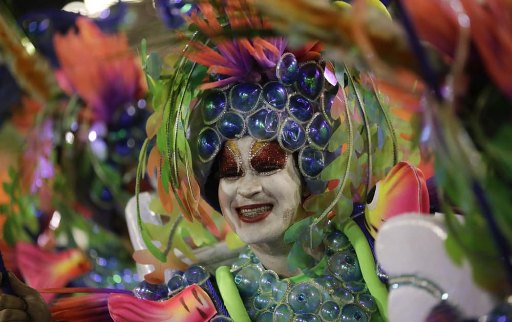 A performer from Uniao da Ilha samba school parades during Carnival celebrations at the Sambadrome in Rio de Janeiro, Brazil.