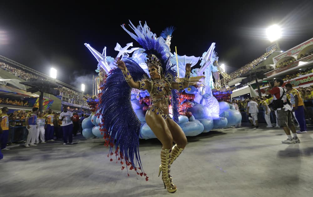 A performer from the Uniao da Ilha samba school dances during Carnival celebrations at the Sambadrome in Rio de Janeiro, Brazil.