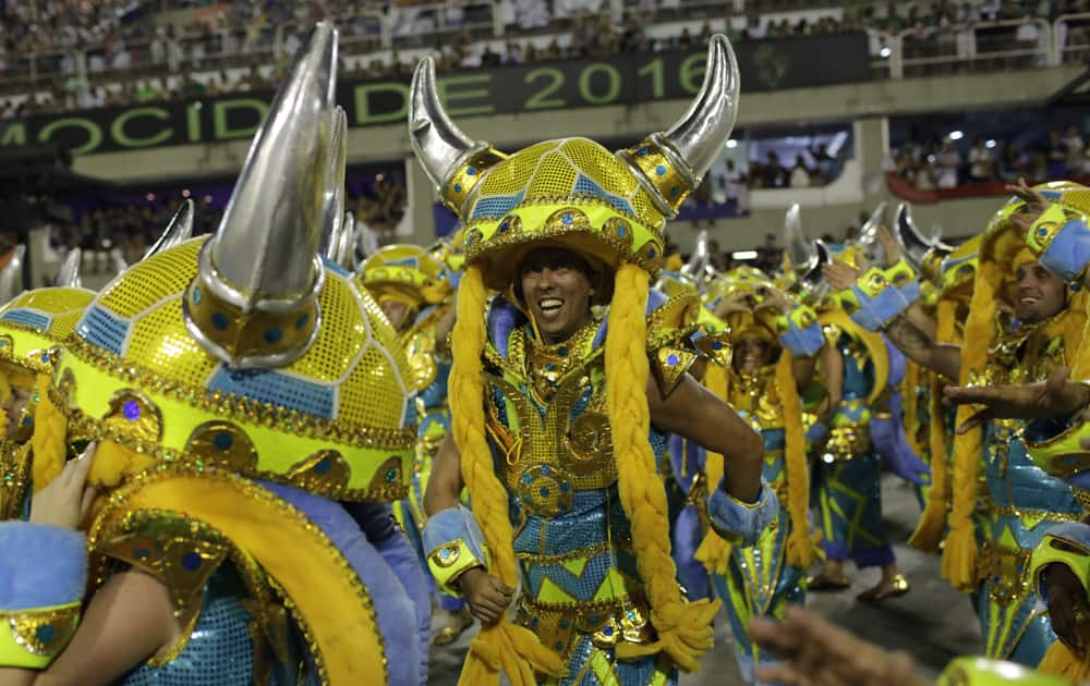 A performer from Grande Rio samba school parades during the Carnival celebrations at the Sambadrome in Rio de Janeiro, Brazil.