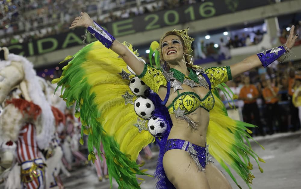 A performer from Grande Rio samba school parades during the Carnival celebrations at the Sambadrome in Rio de Janeiro, Brazil.