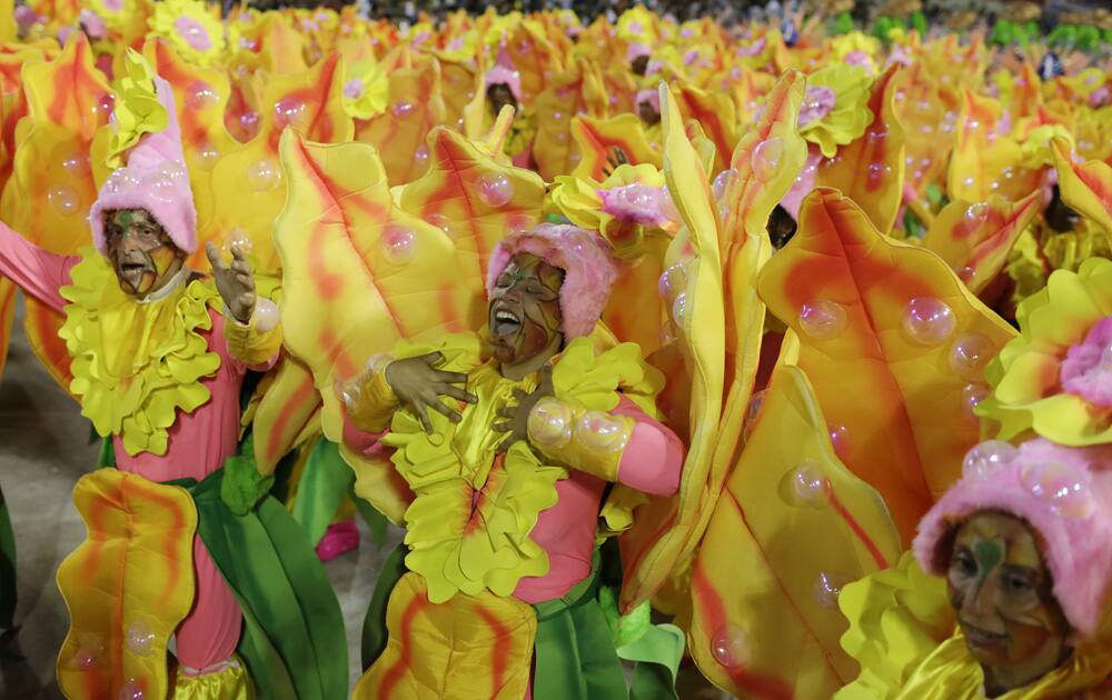 Performers from Grande Rio samba school parade during the Carnival celebrations at the Sambadrome in Rio de Janeiro, Brazil.