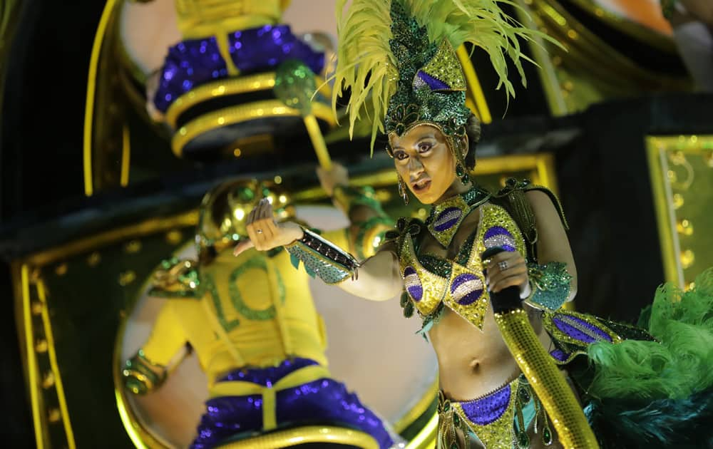 A performer from Grande Rio samba school parades on a float during the Carnival celebrations at the Sambadrome in Rio de Janeiro, Brazil.