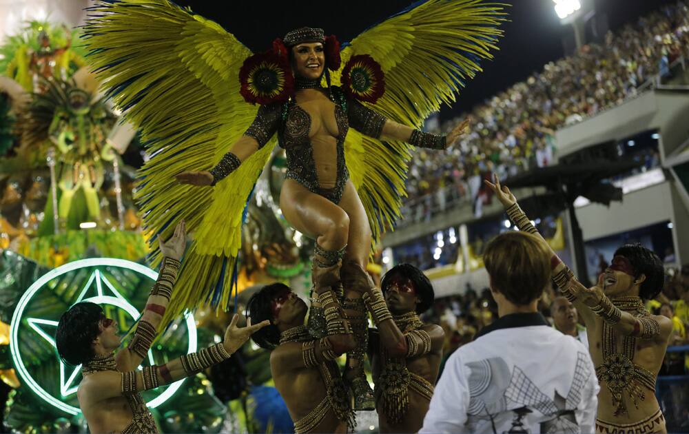 Performers from the Mocidade samba school parade during carnival celebrations at the Sambadrome in Rio de Janeiro, Brazil.