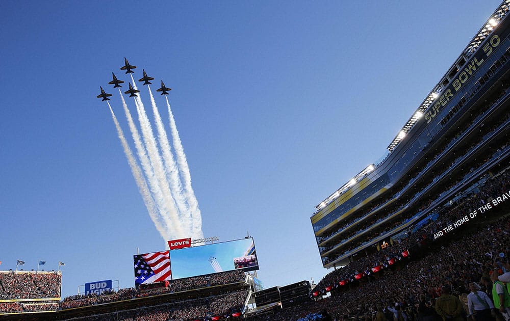 The Blue Angels fly over the stadium before the NFL Super Bowl 50 football game.