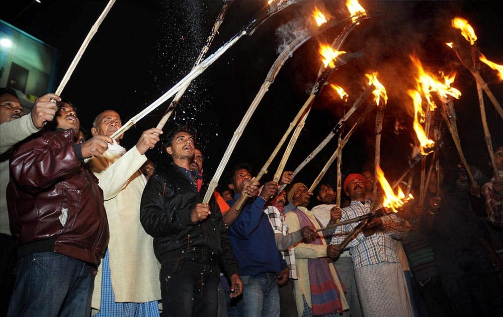 Ranchi Municipal Corporation workers take out a torch light procession for their various demands in Ranchi.