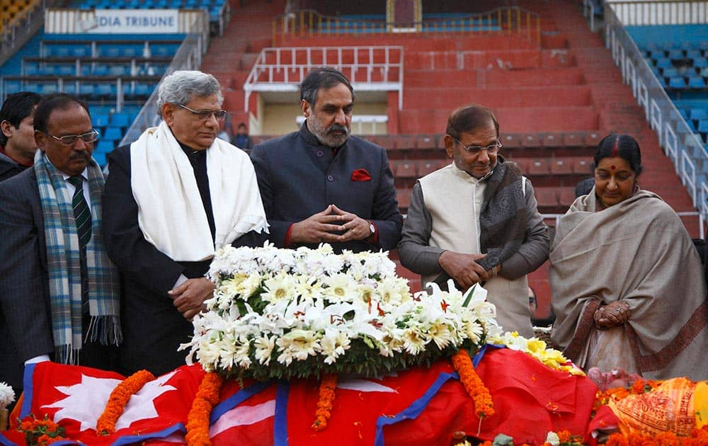 National Security Advisor Ajit Doval, Communist Party of India (Marxist) Secretary Sitaram Yechury Congress party leader Anad Sharma, Janata Dal party leader Sharad Yadav and Indian Minister for External Affairs Sushma Swaraj, pay respect near the body of former prime minister Sushil Koirala, at the national stadium in Kathmandu, Nepal.