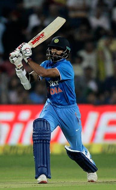 Shikhar Dhawan plays a stroke during the first T20 match between India and Sri Lanka in Pune.