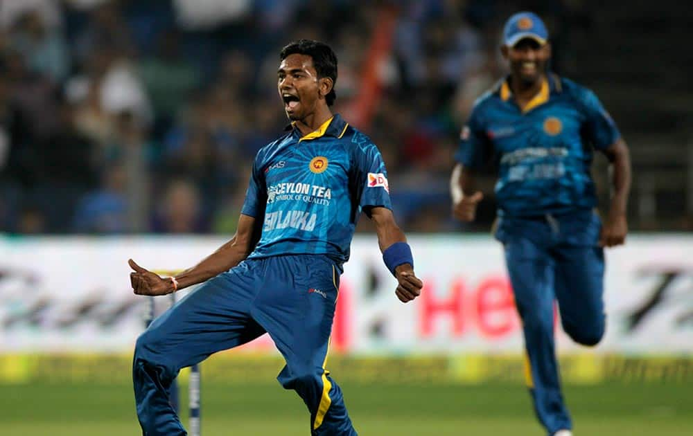 Sri Lanka cricket player Dushmantha Chameera celebrates during the first T20 match between India and Sri Lanka in Pune.