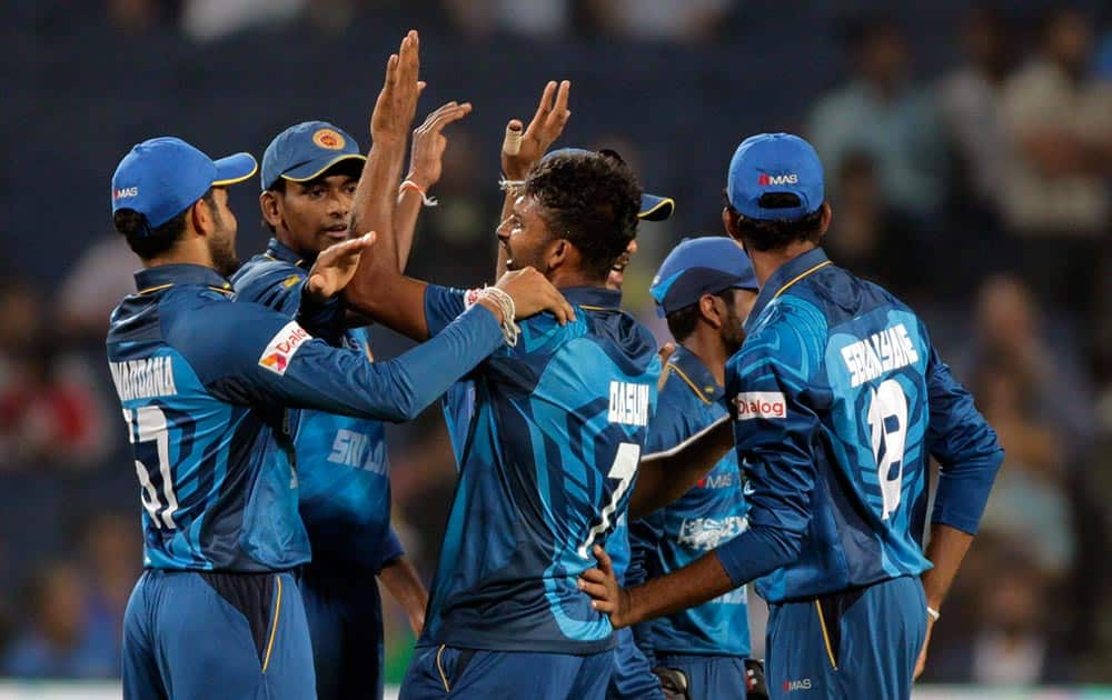 Sri Lanka cricket player Dasun Shanaka celebrates during the first T20 match between India and Sri Lanka in Pune