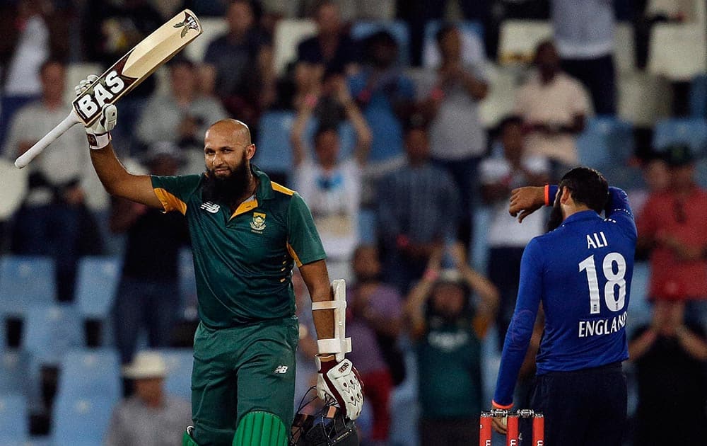 South African batsman Hashim Amla, left, raises his bat after reaching a century off an England’s bowler Moeen Ali, right, delivery during the 3rd One Day International cricket match between South Africa and England at the Centurion Park stadium in Pretoria.
.