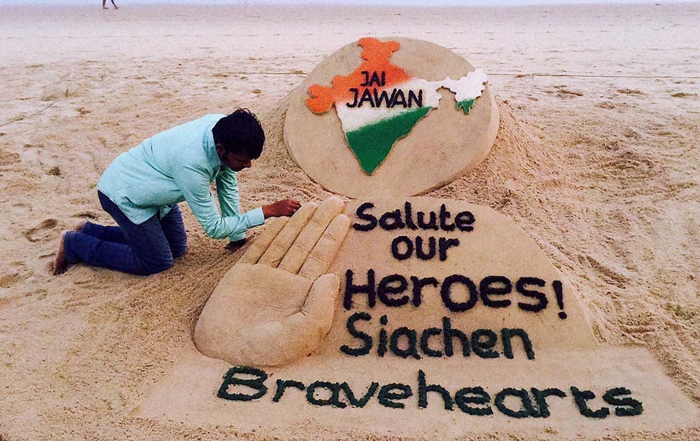 Sand artist Sudarsan Pattnaik pays tribute to Lance Naik Hanumanthappa Koppad at Puri sea beach.